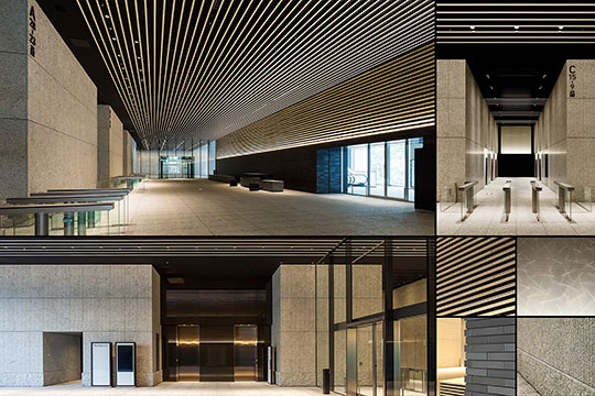 エントランスホール / 練塀をモチーフとした壁面をクラフト感のある素材で構成